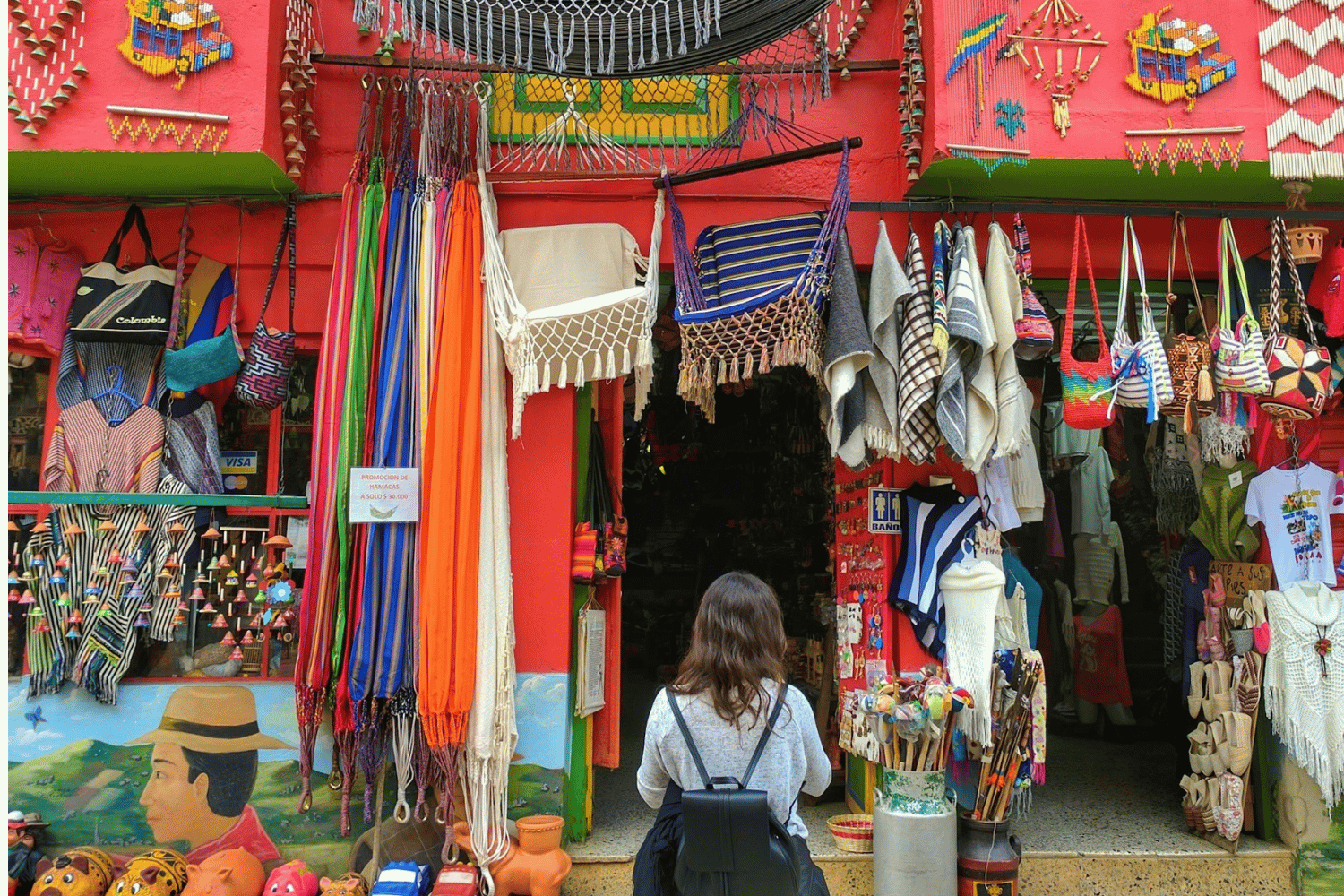 Ráquira, Colombia. Group traveller looking in shop